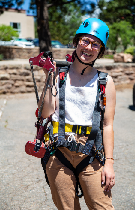 lady wearing a helmet and harness